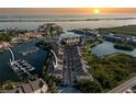 Gorgeous sunset aerial of the community featuring private boat docks and lush manicured landscaping at 4339 Spinnaker Cove Ln, Tampa, FL 33615