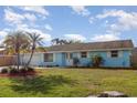 Charming single-story home showcases a well-manicured lawn and inviting front entrance at 608 Florida S Cir, Apollo Beach, FL 33572