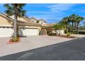 Charming home featuring a three car garage, tile roof, and beautifully landscaped front yard at 7313 Gaberia Rd, Trinity, FL 34655