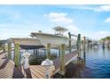 View of private boat dock and boats on a sunny day at 1026 Bellasol Way # 4403, Apollo Beach, FL 33572