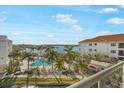 Scenic view from balcony overlooking community pool, waterfront, and boat docks at 1026 Bellasol Way # 4403, Apollo Beach, FL 33572