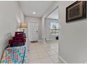 Bright entryway with a view of the front door and adjacent living area at 1454 Tahitian Sunrise Dr, Plant City, FL 33565