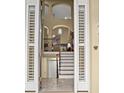 Inviting entryway with a staircase, wrought iron railing, and views of the upper level at 15 Jefferson S Ct, St Petersburg, FL 33711
