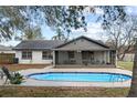 Relaxing backyard oasis with a sparkling in-ground pool, ideal for enjoying sunny days outdoors at 3507 King George Ln, Seffner, FL 33584