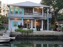 Waterfront home with an elevated patio for outdoor entertaining with serene river views and boat dock at 8117 River Point Dr, Weeki Wachee, FL 34607