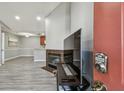 View of the living room and kitchen from the front door with a fireplace and wood-style flooring at 10263 Gandy N Blvd # 2014, St Petersburg, FL 33702