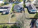 Aerial view of a home with a screened pool enclosure and spacious backyard at 12804 Raysbrook Dr, Riverview, FL 33569