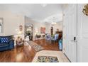 Open-concept foyer with a view of the dining room, hardwood floors, and natural light at 182 Dahoon Ct, Spring Hill, FL 34609