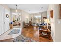 Cozy living room with hardwood floors, comfortable seating, and a large window offering ample natural light at 182 Dahoon Ct, Spring Hill, FL 34609