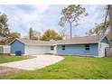 Beautiful single-story home with a well-maintained lawn and driveway at 20004 Harvie Ln, Lutz, FL 33558