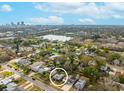 Aerial view of a residential neighborhood featuring a lake and skyline in the distance with the home circled at 2454 15Th N Ave, St Petersburg, FL 33713