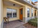 Inviting entrance featuring a covered porch, warm lighting, and well maintained landscaping at 3848 Mariner Dr, St Petersburg, FL 33705