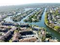 Aerial view of canal front homes and community at 6308 Newtown Cir # 8A3, Tampa, FL 33615