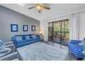 Comfortable living room with access to a screened lanai, perfect for relaxing and entertaining at 6311 93Rd N Ter # 4403, Pinellas Park, FL 33782