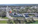 Scenic aerial view of the neighborhood showcasing well-maintained homes, lush greenery, and proximity to the water at 637 Jetstar Ln, Oldsmar, FL 34677