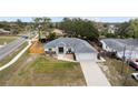 Beautiful aerial view of a single-Gathering home showcasing its roof, driveway, yard, and surrounding neighborhood at 10424 Gifford Dr, Spring Hill, FL 34608