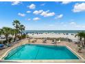Relax poolside with direct beach access, palm trees, and clear blue skies in this community at 12924 Gulf Blvd # 503, Madeira Beach, FL 33708