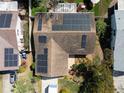 Aerial view of home with solar panels on the roof and well maintained landscaping at 1363 Overlea Dr, Dunedin, FL 34698