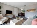 Comfortable living room featuring modern decor, wood floors, and a view into the dining area at 1400 Gandy N Blvd # 502, St Petersburg, FL 33702