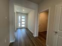 Inviting home foyer with durable flooring and natural light streaming through the front door at 17049 James Trl, Parrish, FL 34219