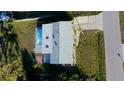 Aerial view of a home featuring a private backyard swimming pool and patio area at 184 Garden Nw Ave, Port Charlotte, FL 33952