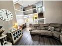 Comfortable living space with hardwood floors, staircase, and ample natural light at 1988 Georgia S Cir, Clearwater, FL 33760