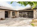 This house features an attached garage and well-kept front exterior with a concrete driveway at 2427 Comerwood Dr, Spring Hill, FL 34609