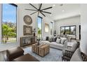 Bright living room featuring high ceilings, modern decor, large windows, and an open layout for entertaining at 4501 24Th S Ave, St Petersburg, FL 33711