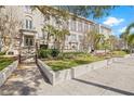 The beautiful exterior features large windows and manicured landscape at 701 Mirror Lake N Dr # 216, St Petersburg, FL 33701