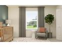 Charming Bedroom features a window view, comfortable rocking chair, and stylish decor at 9352 Bonita Mar Dr, Parrish, FL 34219