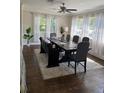 Bright dining room featuring hardwood floors and lots of natural light at 1712 Long Bow Ln, Clearwater, FL 33764