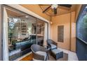 Cozy balcony with comfortable seating, perfect for relaxing and enjoying the view at 2138 Chianti Pl # 142, Palm Harbor, FL 34683