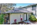 Charming house exterior with a cozy, enclosed porch and lovely landscaping at 2904 Lichen Ln # A, Clearwater, FL 33760