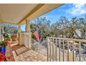Relaxing front porch offers outdoor seating and views of the neighborhood, perfect for enjoying the outdoors at 536 Ontario Ave, Crystal Beach, FL 34681