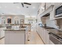 Modern kitchen featuring granite counters, stainless steel appliances and marble floors at 102 Adriatic Ave, Tampa, FL 33606