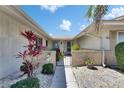 Charming courtyard entry, beautifully landscaped with stone walkway at 1504 Valley Forge Blvd, Sun City Center, FL 33573