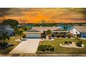 Charming single-story home boasts lush landscaping, a two-car garage at 1504 Valley Forge Blvd, Sun City Center, FL 33573