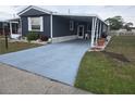 Single-story home with covered parking and easy access from the well-maintained driveway at 1710 7Th Sw St # 93, Ruskin, FL 33570