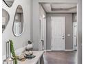 Modern entryway featuring neutral walls, stylish mirror, and a sleek console table at 17110 James Trl, Parrish, FL 34219