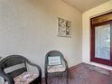 Inviting front porch with comfortable seating, perfect for relaxing at 19724 Fort King Run, Brooksville, FL 34601