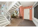 Entrance featuring a staircase to the units above a private entry, all bathed in natural light at 3600 42Nd S St # 52B, St Petersburg, FL 33711