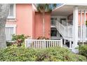 Charming condo exterior with a palm tree and white stairway at 3600 42Nd S St # 52B, St Petersburg, FL 33711