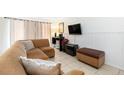 Cozy living room with a comfortable sectional sofa, perfect for relaxing and entertaining guests at 3600 42Nd S St # 52B, St Petersburg, FL 33711