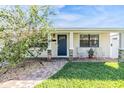 Inviting front porch with brick walkway and seating area at 3913 29Th N St, St Petersburg, FL 33714