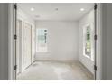 Light filled bedroom with closet and two windows, offering a simple yet elegant canvas for customization at 868 44Th N Ave, St Petersburg, FL 33703