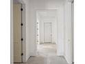 Bright hallway with white walls and trim detail, awaiting personalized touches to complete the space at 868 44Th N Ave, St Petersburg, FL 33703