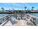 Inviting wooden dock furnished with lounge chairs, offering serene water views and relaxation at 18675 Us Highway 19 N # 217, Clearwater, FL 33764