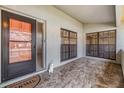 Inviting front porch with decorative tile flooring, plants and plenty of natural light at 2263 Citrus Ct, Clearwater, FL 33763
