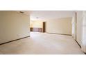 Spacious living room offering vintage wallpaper, wainscoting, and light-colored carpeting at 2430 Catalonia S Way, St Petersburg, FL 33712