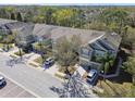 Enjoy this aerial view of a neighborhood showcasing townhouses with lush surroundings, and convenient parking at 2712 Conch Hollow Dr, Brandon, FL 33511